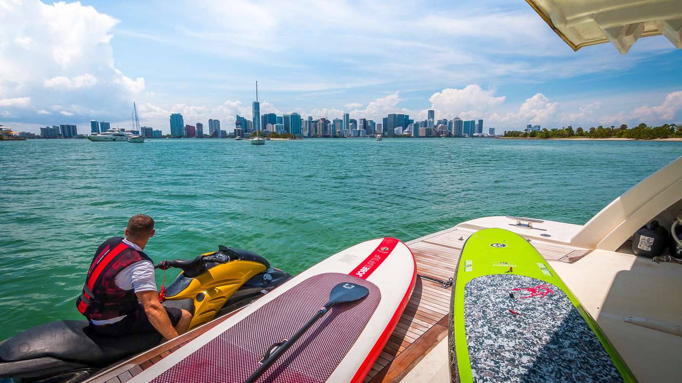 Jet ski and paddleboards at the swim platform